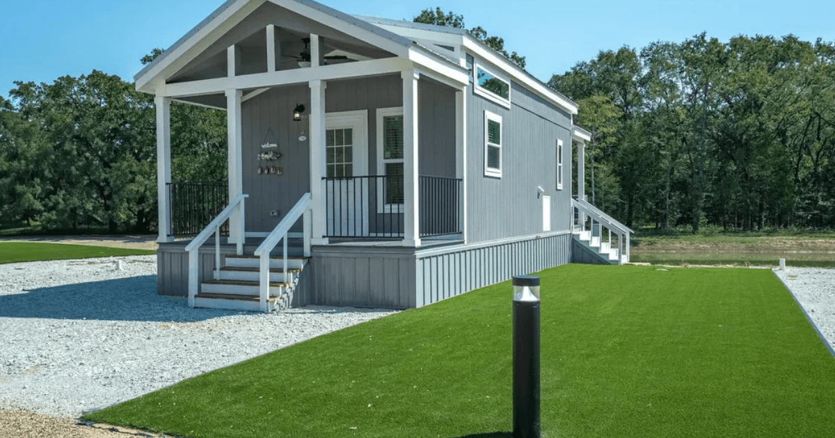 Gated 55+ tiny home lane with landscaped cottages at Elken Village near Canton, Texas.
