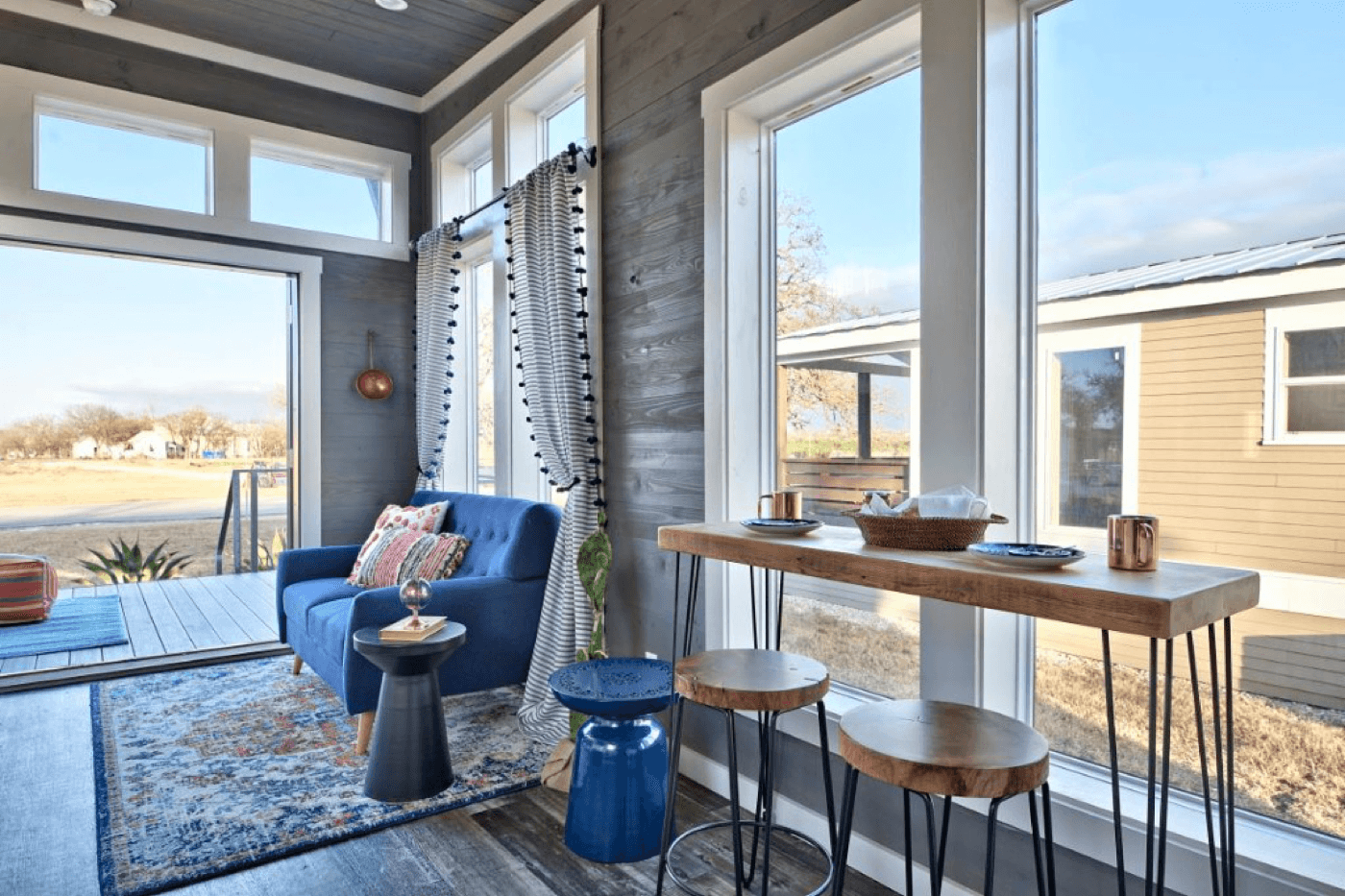 Tiny homes nestled among organic farm fields and green space at Village Farm Austin agrihood in East Austin, Texas.