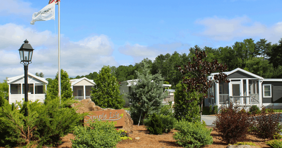Gated pocket-neighborhood cottages and landscaped walking loops at Simple Life in Flat Rock, North Carolina.