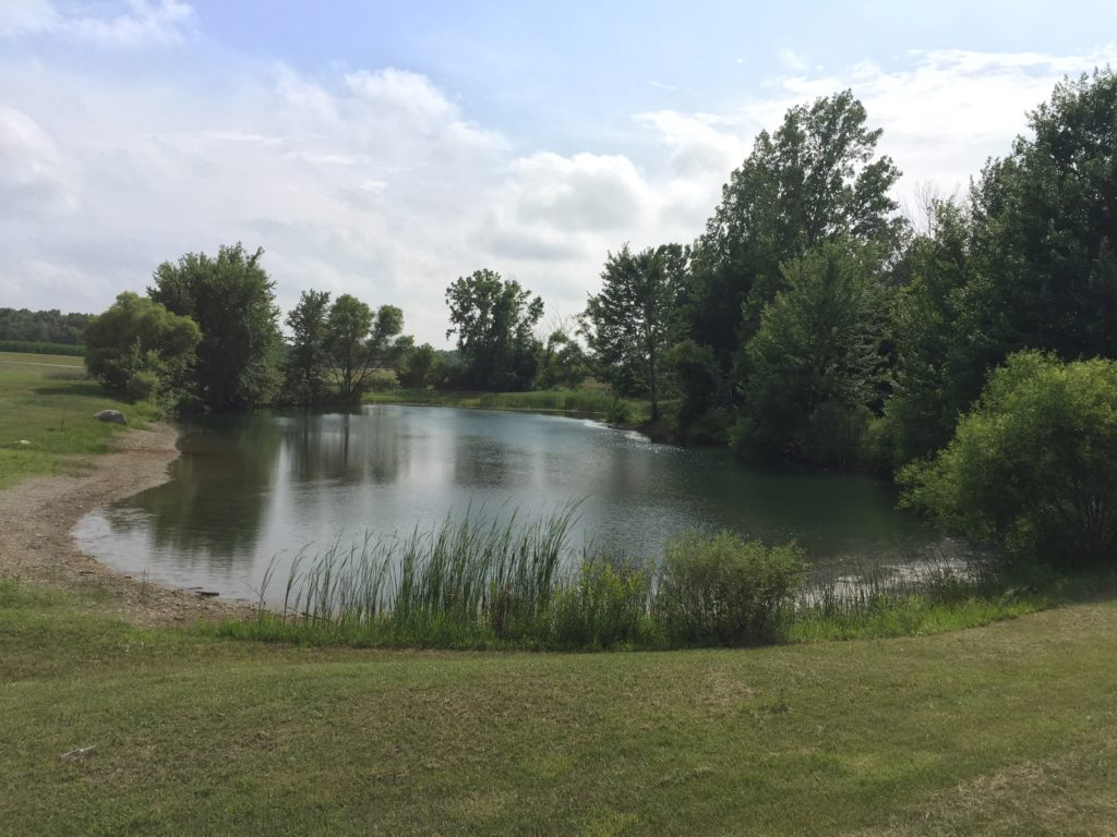 Wooded country lanes and open meadow views at Big Oak Campground near Muncie, Delaware County, Indiana.